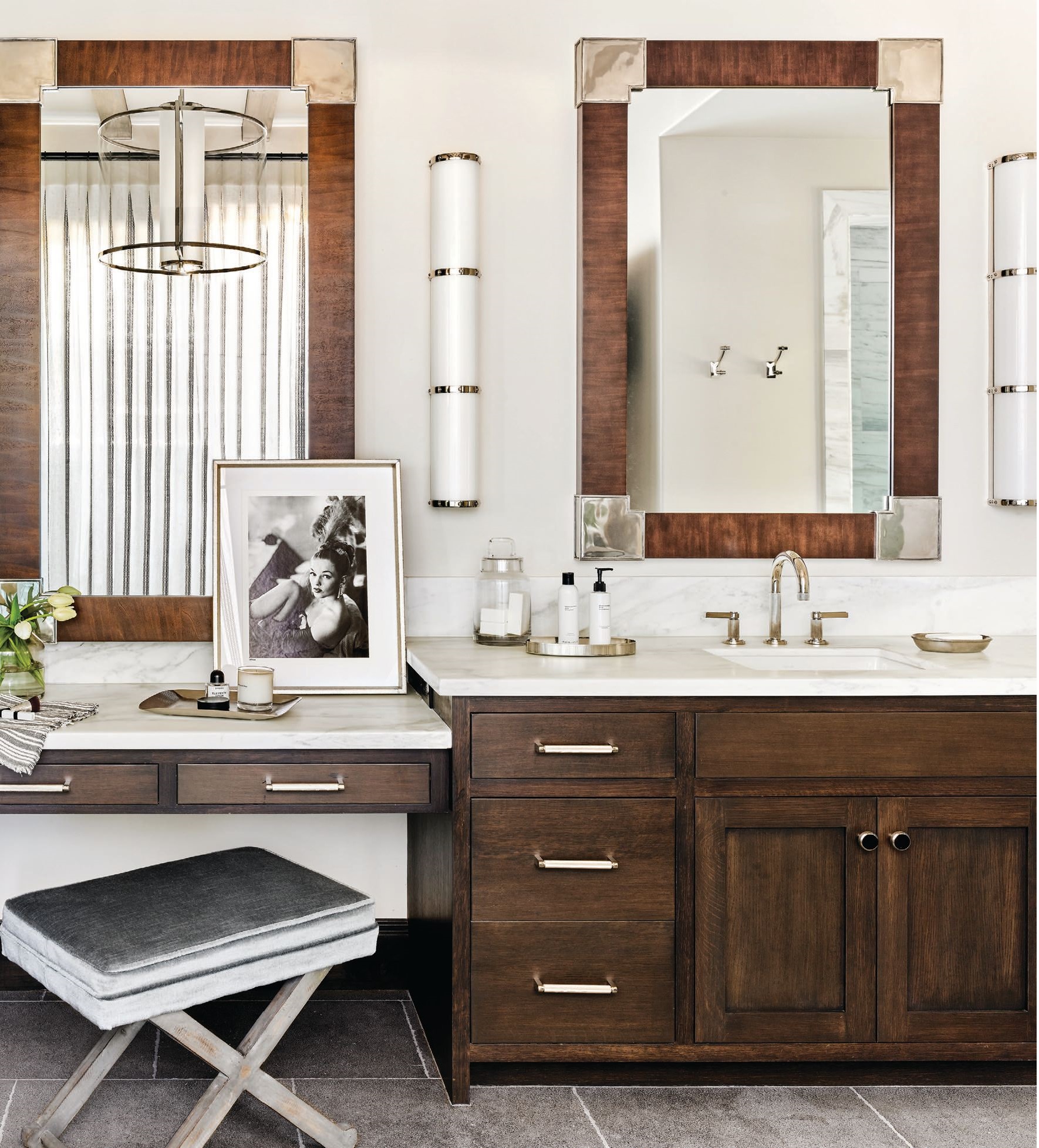 The primary bathroom’s limestone floors by Craftsman Court Ceramics blend harmoniously with vanities by Desert Cove Woodworks and handsome mirrors by Hickory Chair. PHOTOGRAPHED BY WERNER SEGARRA
