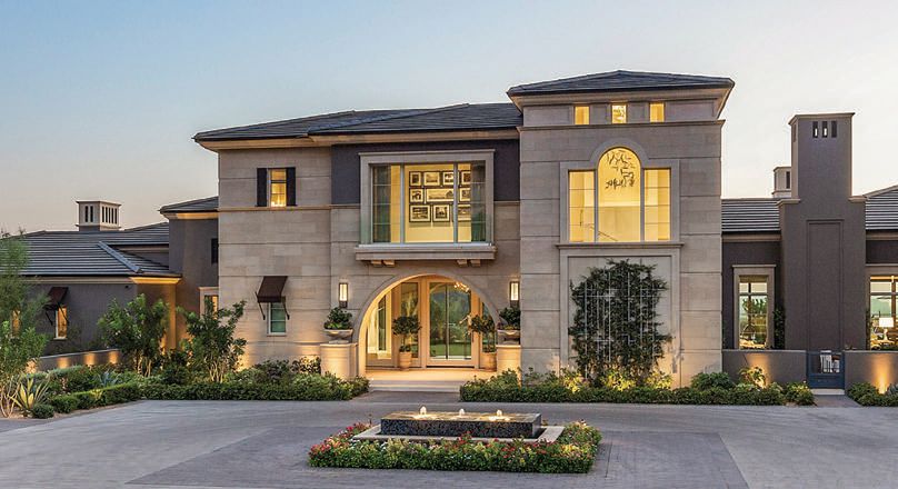 The entrance to the stunning home is dual-gated for ample privacy and security PHOTO BY INDY FERRUFINO