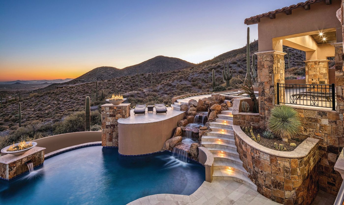 Situated atop all of Desert Mountain, new owners can enjoy views of the entire valley from its grand outdoor spaces. PHOTO COURTESY OF RUSS LYON SOTHEBY’S INTERNATIONAL REALTY