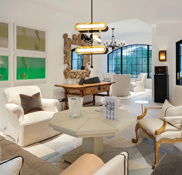 Boland created an eclectic living room space centered around a leather-clad cocktail table made in Mexico by Casamidy with chairs upholstered in fabrics from John Saladino and Rose Tarlow. Lighting is from Apparatus Studio, Ralph Lauren and Blackman Cruz, and the artwork is by Jorge Pardo. PHOTOGRAPHED BY JOE COTITTA