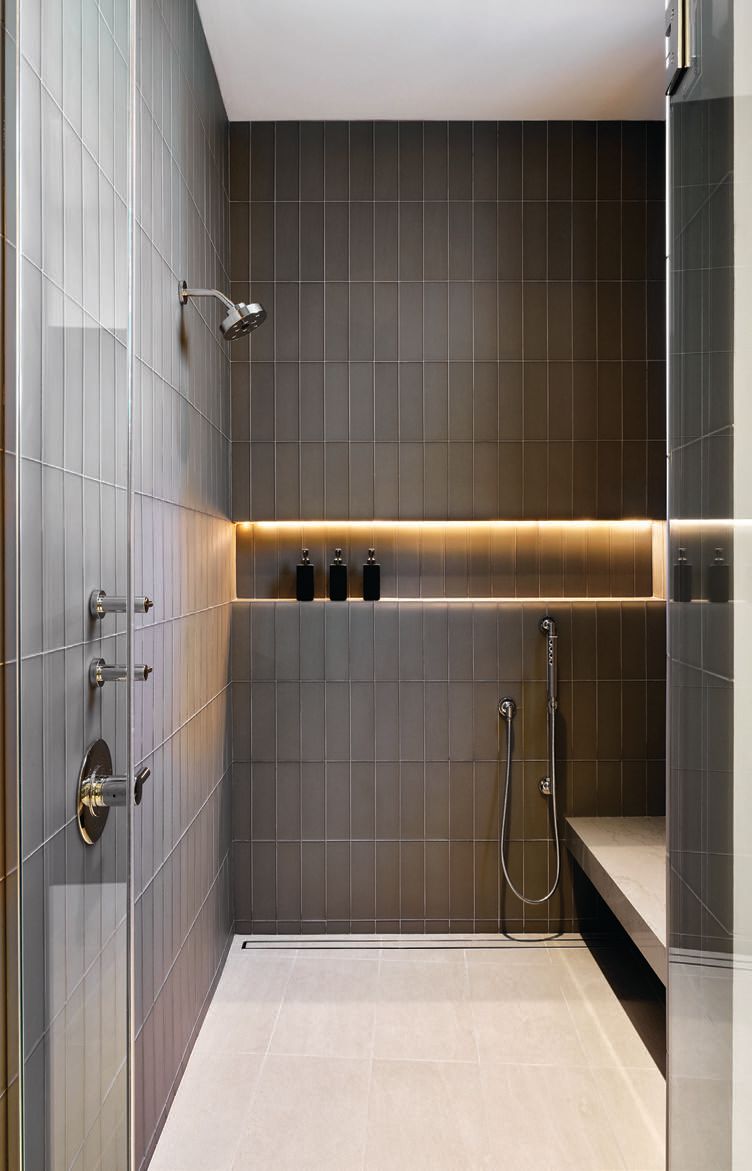 The guest bathroom shower uses contrasting tile for visual oomph. PHOTOGRAPHED BY WERNER SEGARRA