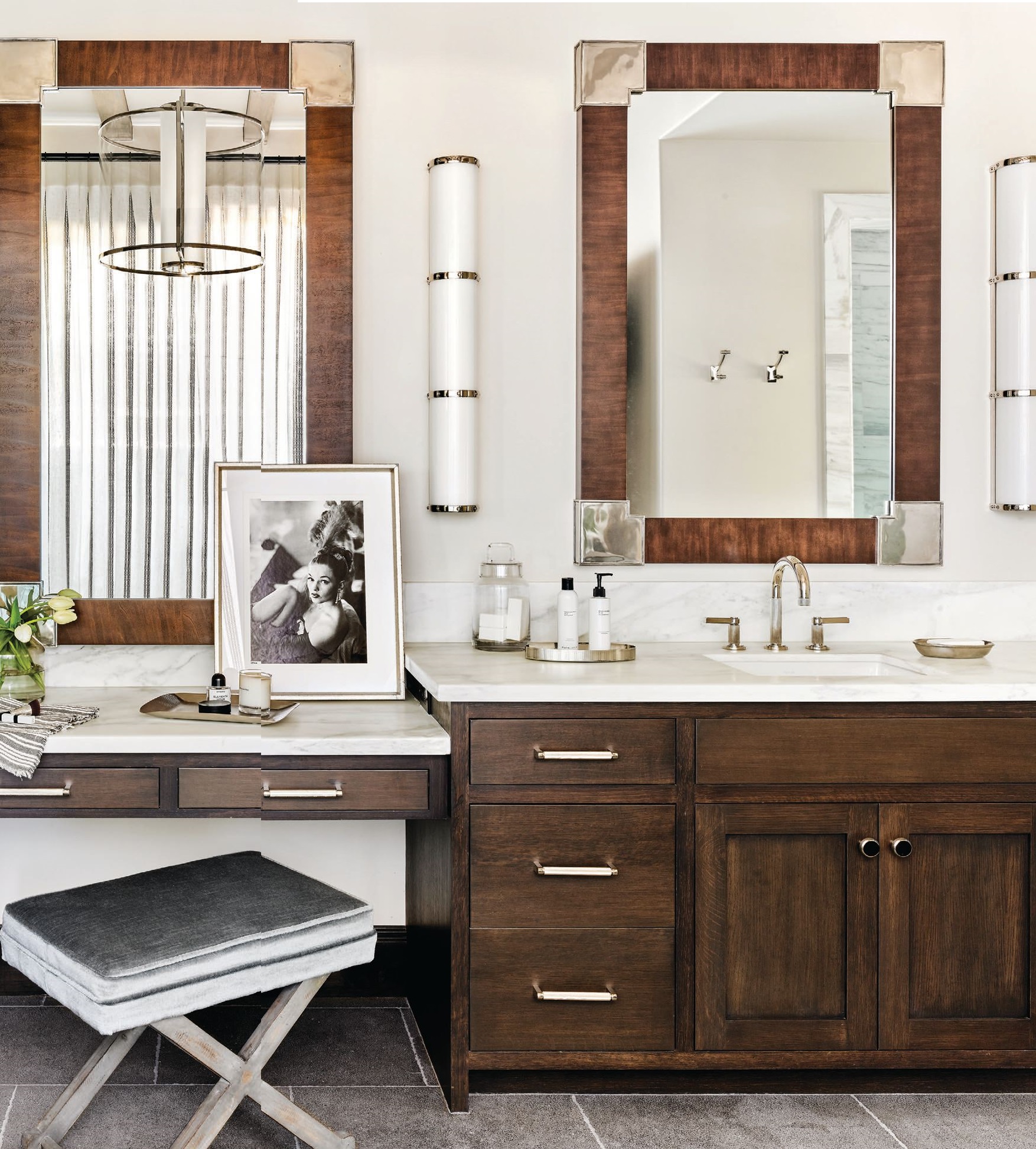 The primary bathroom’s limestone floors by Craftsman Court Ceramics blend harmoniously with vanities by Desert Cove Woodworks and handsome mirrors by Hickory Chair. PHOTOGRAPHED BY WERNER SEGARRA